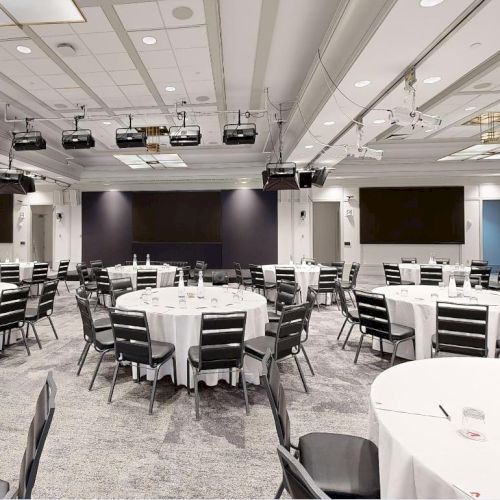 Conference room with rounds and screens