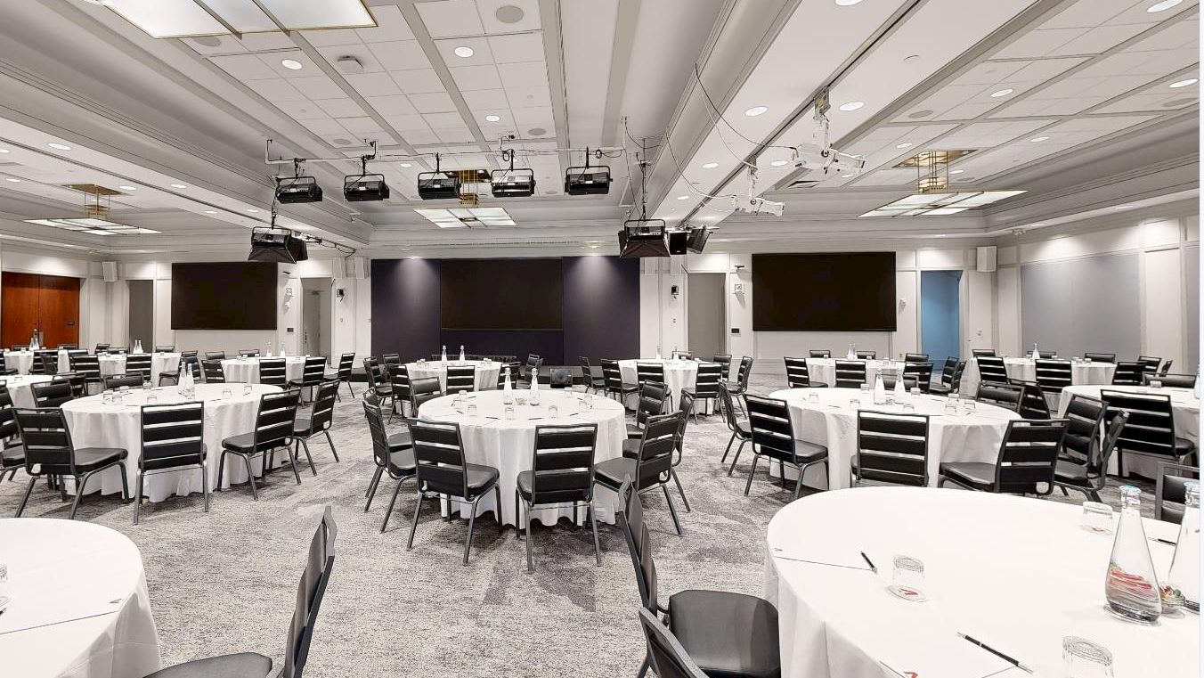 Conference room with rounds and screens