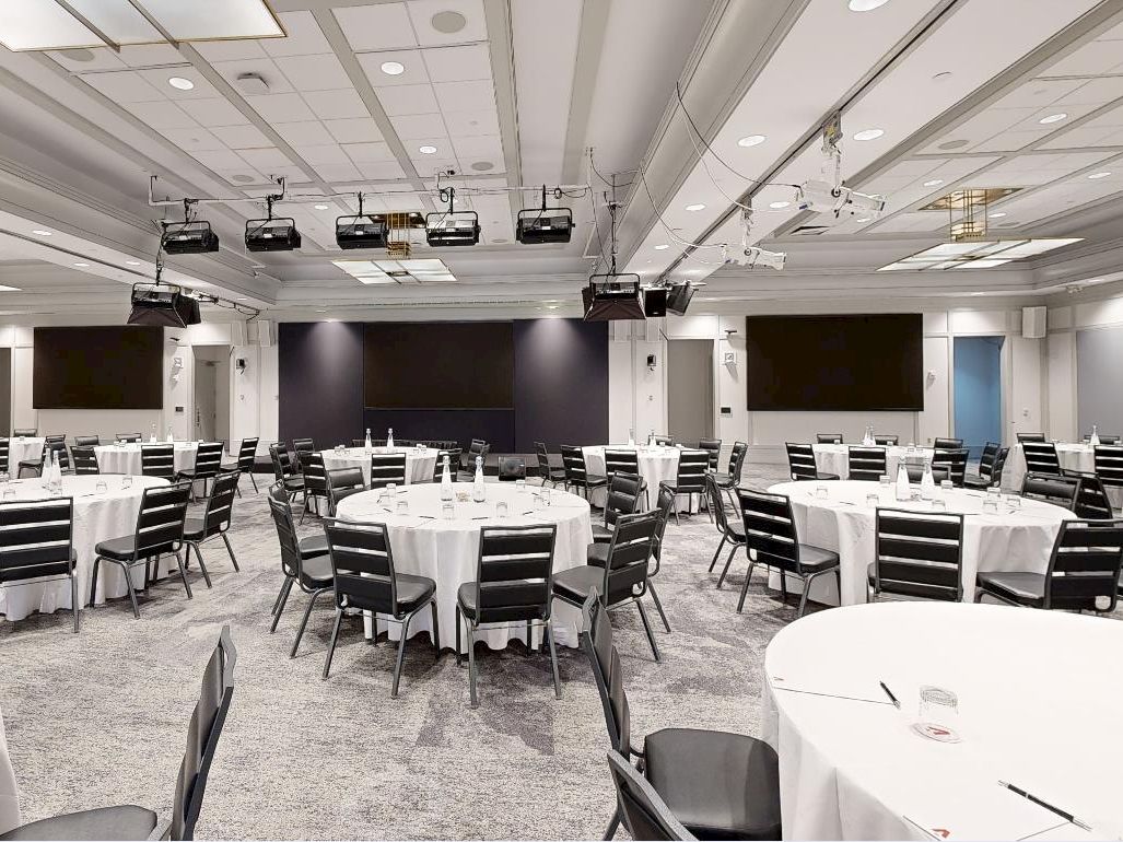 Conference room with rounds and screens